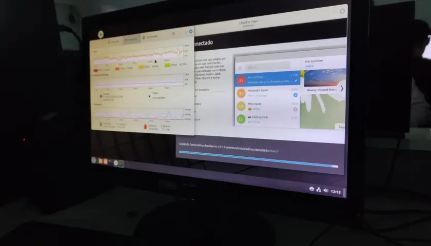 Monitor z systemem Linux, pokazujący wykresy użycia CPU i sieci. Idealny dla początkujących w świecie linux.