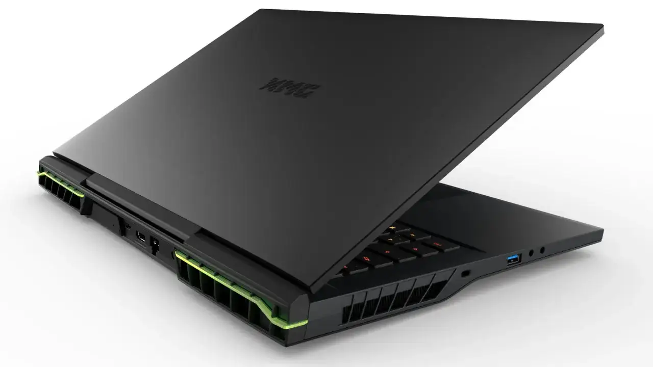 Czarny laptop gamingowy z podświetlaną klawiaturą i zielonymi akcentami, napędzany procesorem Ryzen 9 6900HX.