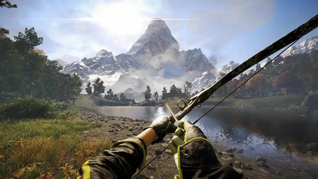 Gracz z łukiem w rękach podziwia majestatyczne g&oacute;ry. Gra Far Cry 4 wymaga pięknej grafiki, by docenić takie widoki.